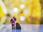 Miniature Santa Claus With Beautiful Light Bokeh Background. Chr Stock Photo