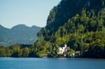 Castle Schloss On The Shoreline Of Lake Hallstatt Stock Photo