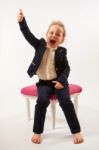 Little Girl In Black Suit Stock Photo