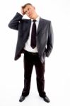 Standing Young Confused Businessman Stock Photo