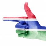 Gambia Flag On Shooting Hand Stock Photo