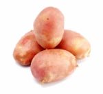 Pile Of Pink Potatoes On White Background Stock Photo