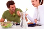 Couple Eating Veg Stock Photo