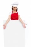 Female Chef Behind Blank Board Stock Photo