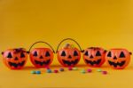 Halloween Jack O Lantern Bucket Filled With Candies Stock Photo