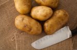 Potato Still Lift On Sack Background Stock Photo