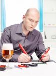 Man Repairing An Electronic Device Stock Photo