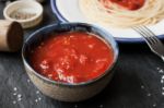 Pureed Tomatoes In A Ceramic Dish On A Table Stock Photo