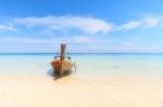 Boat On The Beach With Blue Sky Stock Photo