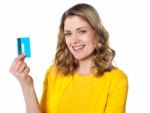 Portrait Of Young Smiling Woman Holding Credit Card Stock Photo