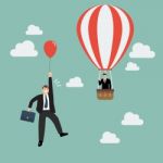 Businessman In Hot Air Balloon Fly Pass Businessman With Red Bal Stock Photo