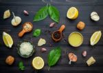 The Ingredients For Green Pesto Sauce On Dark Wooden Background Stock Photo