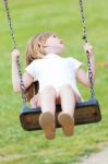 Happy Little Girl Having Fun In The Park Stock Photo