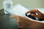 Close Up Hand Use Tablet On Table Stock Photo