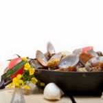 Fresh Clams On An Iron Skillet Stock Photo