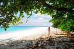 Woman Is Walking On The Beach For Relaxation Stock Photo