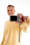 Blonde Man Showing Digital Camera Stock Photo