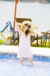 Woman Smiling In Pool Stock Photo