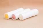 Moisturizer Lipstick On Brown Natural Background Stock Photo