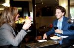 Couple Enjoying Cocktail At The Bar Stock Photo