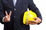 Engineer Holding Helmet On White Background Stock Photo