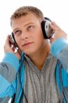 Young Handsome Man Enjoying Music With Headphones Stock Photo