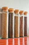 Assortment Of Spices In Glass Bottles Stock Photo