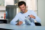 Man Having Tea In Kitchen Stock Photo