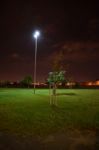 Night Public Park In The City With Houses Near Stock Photo