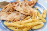 Turkey Steak With French Fries Stock Photo