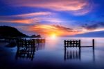 Seascape With Row Of Wood At Sunset Stock Photo