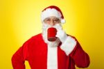 Relaxed Santa Enjoying His Cup Of Coffee Stock Photo