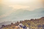 Instagram Filter Young Man Asia Tourist At Mountain Is Watching Over The Misty And Foggy Morning Sunrise, Travel Trekking Stock Photo