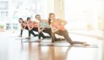 Asian Woman Doing Yoga Indoors Stock Photo