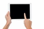 Finger Being Pointed On Tablet Screen Stock Photo