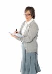 Senior Woman Writing In Notebook Stock Photo