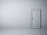 Empty Wall With Closed Door Stock Photo