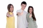 Teenage Friends Showing Thumbs Up Stock Photo