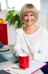 Casual Blonde Businesswoman In Office Stock Photo