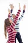 People With Raised Arms And Looking Upward Stock Photo