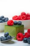 Green Tea Matcha Mousse Cake With Berries Stock Photo