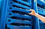 People Fix Server Network In Data Room Stock Photo