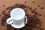 White Empty Cup And Coffee Beans Stock Photo