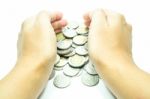 Hand On Thai Baht Coins On White Table Background Stock Photo