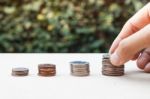 Woman Hand Putting Money Coin Stock Photo