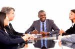 Multi Ethnic Team During Meeting Stock Photo