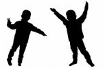 Silhouettes Of Two Little Boys Stock Photo