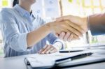 Businessmen Shaking Hands During A Meeting Stock Photo