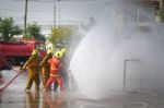 Fireman. Firefighters Fighting Fire During Training Stock Photo