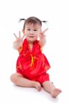 Little Asian Girl (thai) In Traditional Chinese Cheongsam Stock Photo